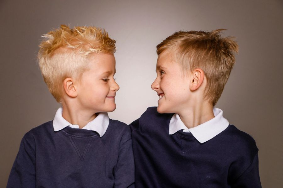 Two brothers smiling at each other